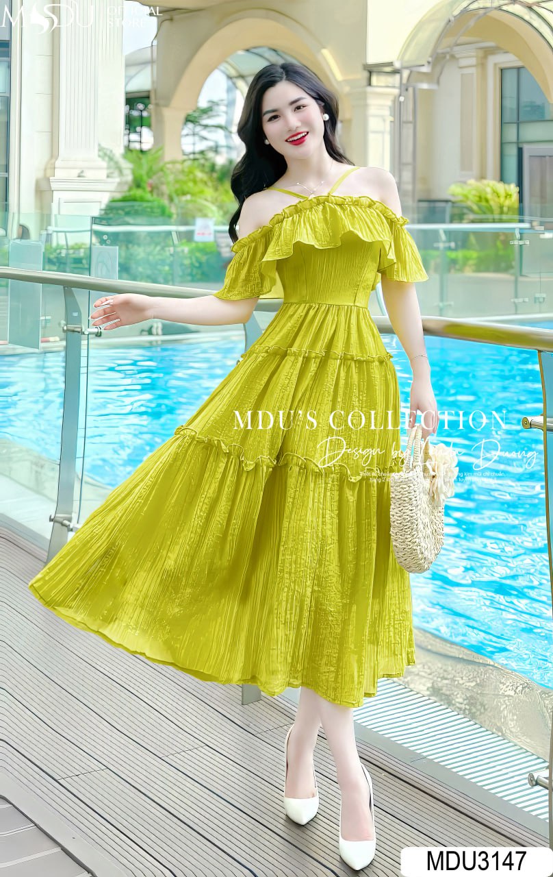 Các kiểu váy đi biển màu xanh bơ hot trend nhất 2025 - 